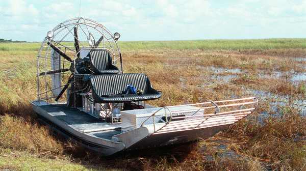 An airboat, a.k.a. planeboat, swamp boat, bayou boat, or fanboat.