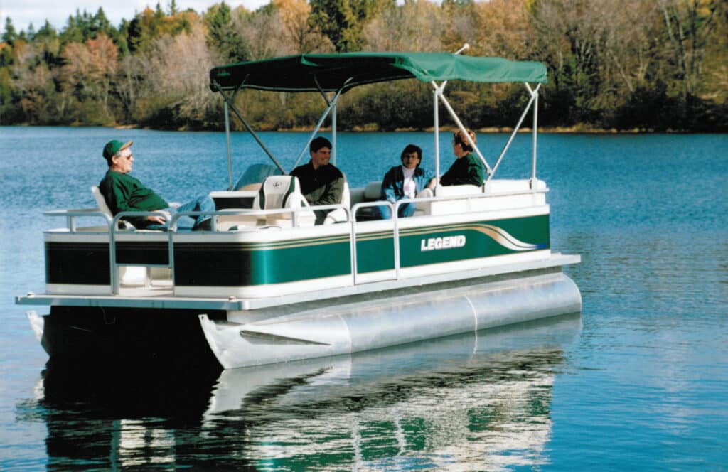 Vintage Legend Boat pontoon photo. Group of people enjoying a relaxing day on the water. Our innovative tube design has been used for many years.