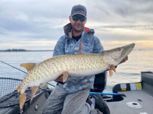 Legend Boats Brand Ambassador Jamie with a catch in his aluminum fishing boat.