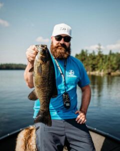 Brand Ambassador and angler Brad Thorn holding up his catch