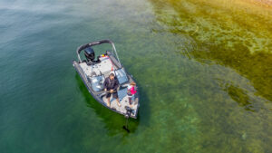 Father and daughter fishing from their previous-year Legend Boats F17