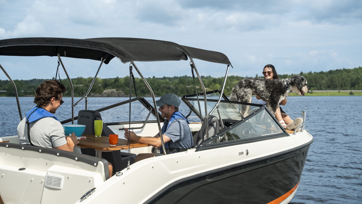Legend Boats Uttern D59 - three people enjoying the sun on the boat