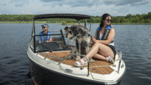 Legend Boats - three people and a dog